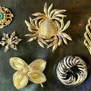 Elegant Gold and Silver Brooches